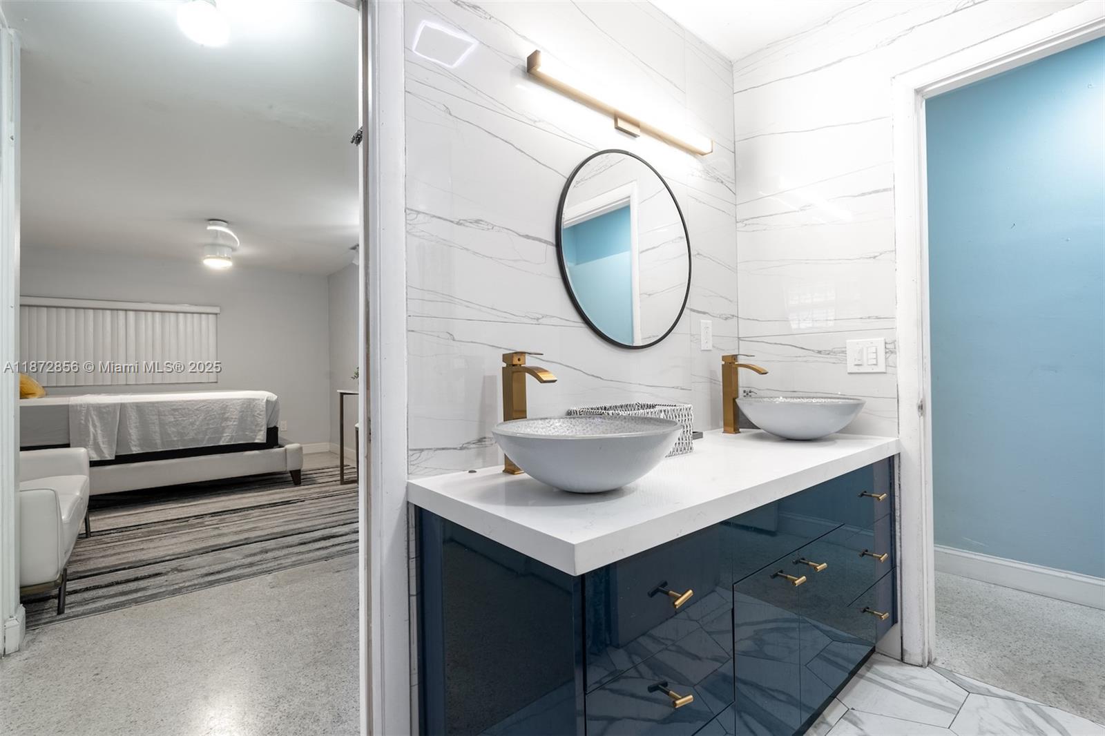 18525 Northwest 39th Avenue Miami Gardens, FL 33055 - Photo 9 of 11 a bathroom with a sink and a mirror