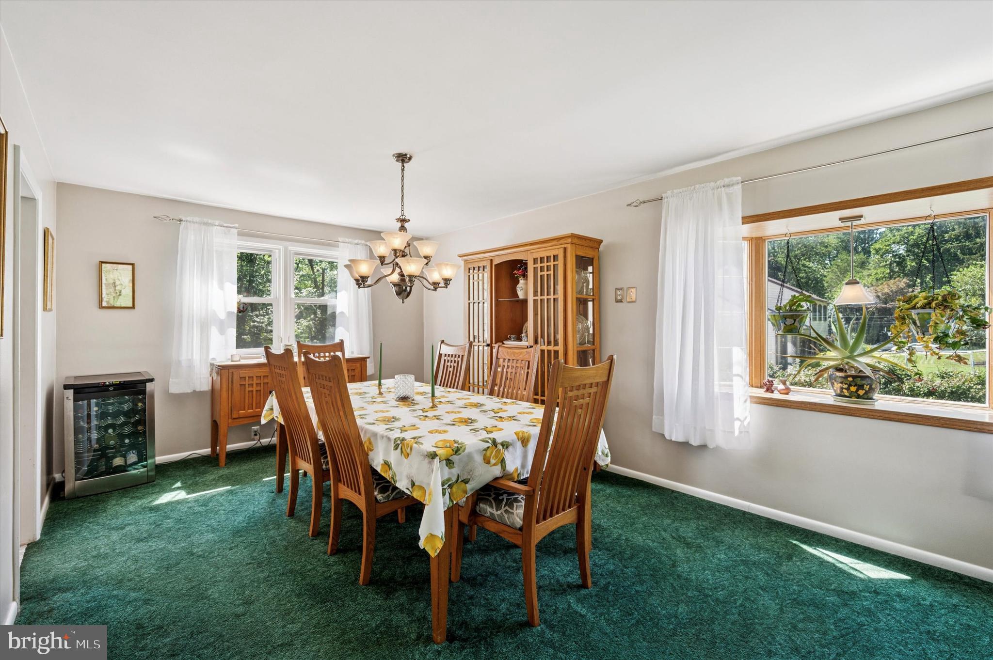 1007 Glen Road Wallingford, PA 19086 - Photo 14 of 50 a view of a dining room with furniture window and wooden floor