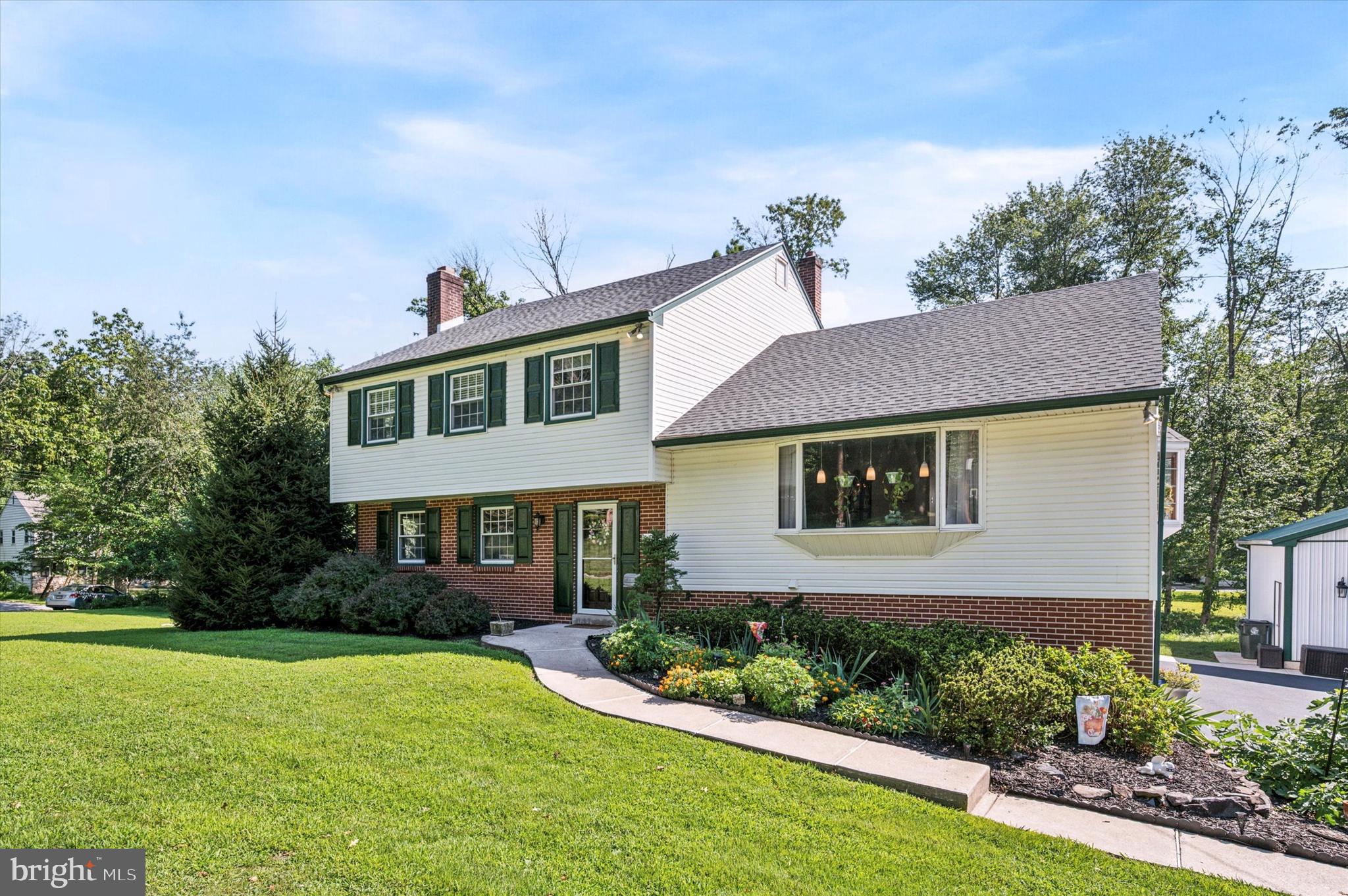 1007 Glen Road Wallingford, PA 19086 - Photo 2 of 50 a front view of a house with a yard