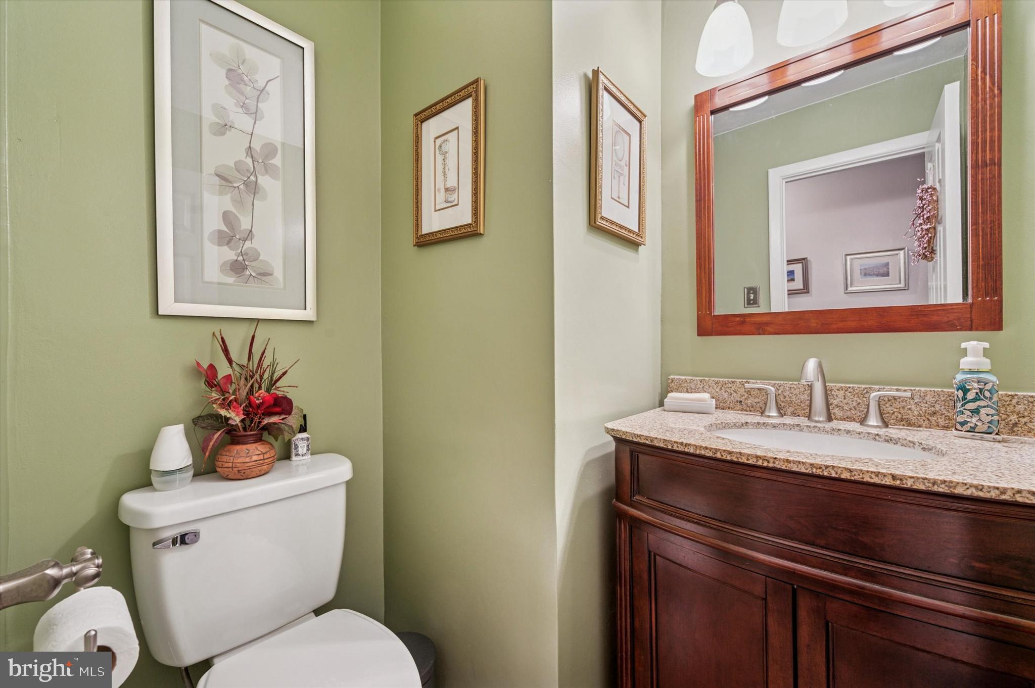 1007 Glen Road Wallingford, PA 19086 - Photo 26 of 50 a bathroom with a toilet a sink and mirror