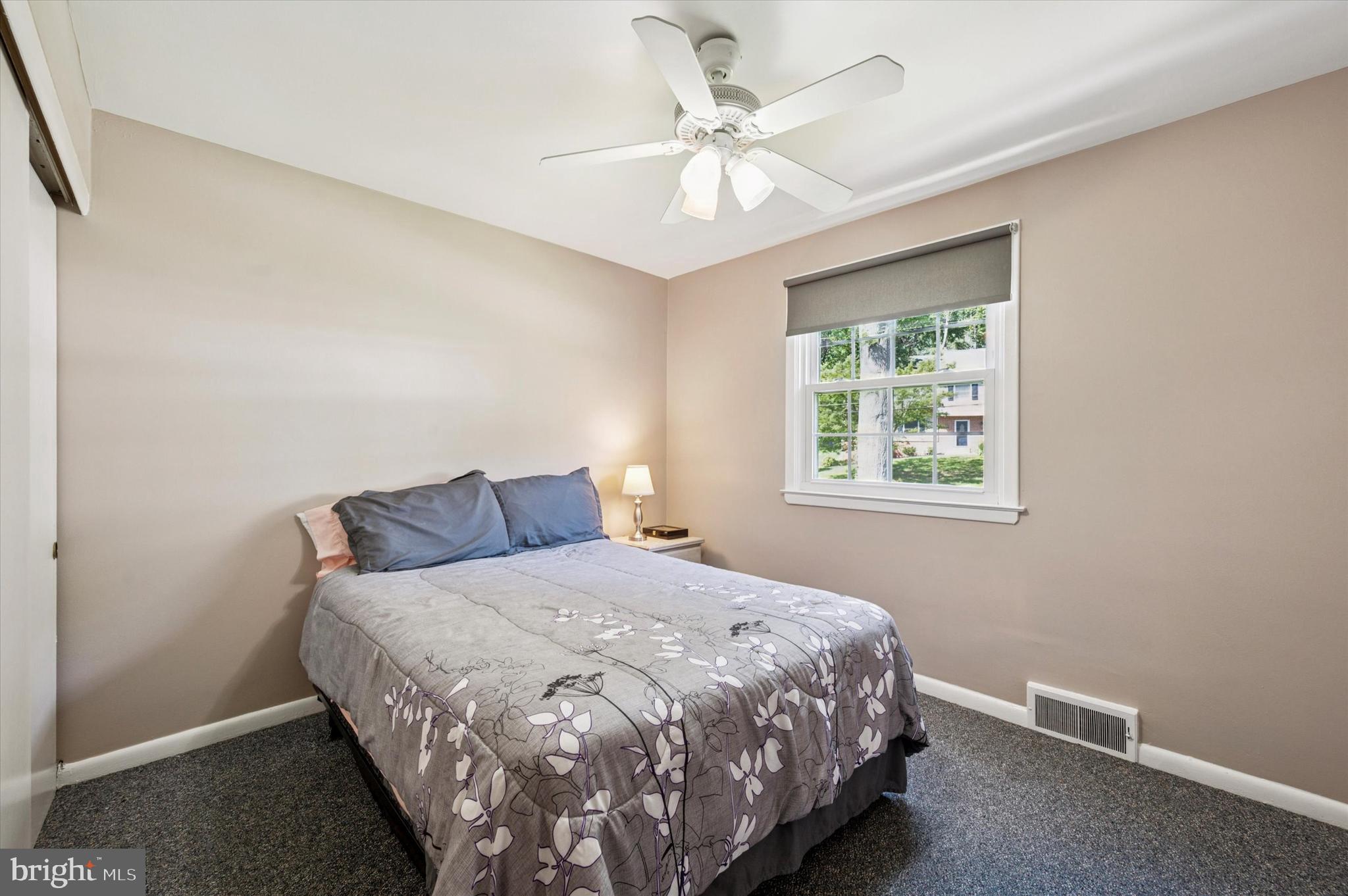 1007 Glen Road Wallingford, PA 19086 - Photo 27 of 50 a bedroom with a bed and a window