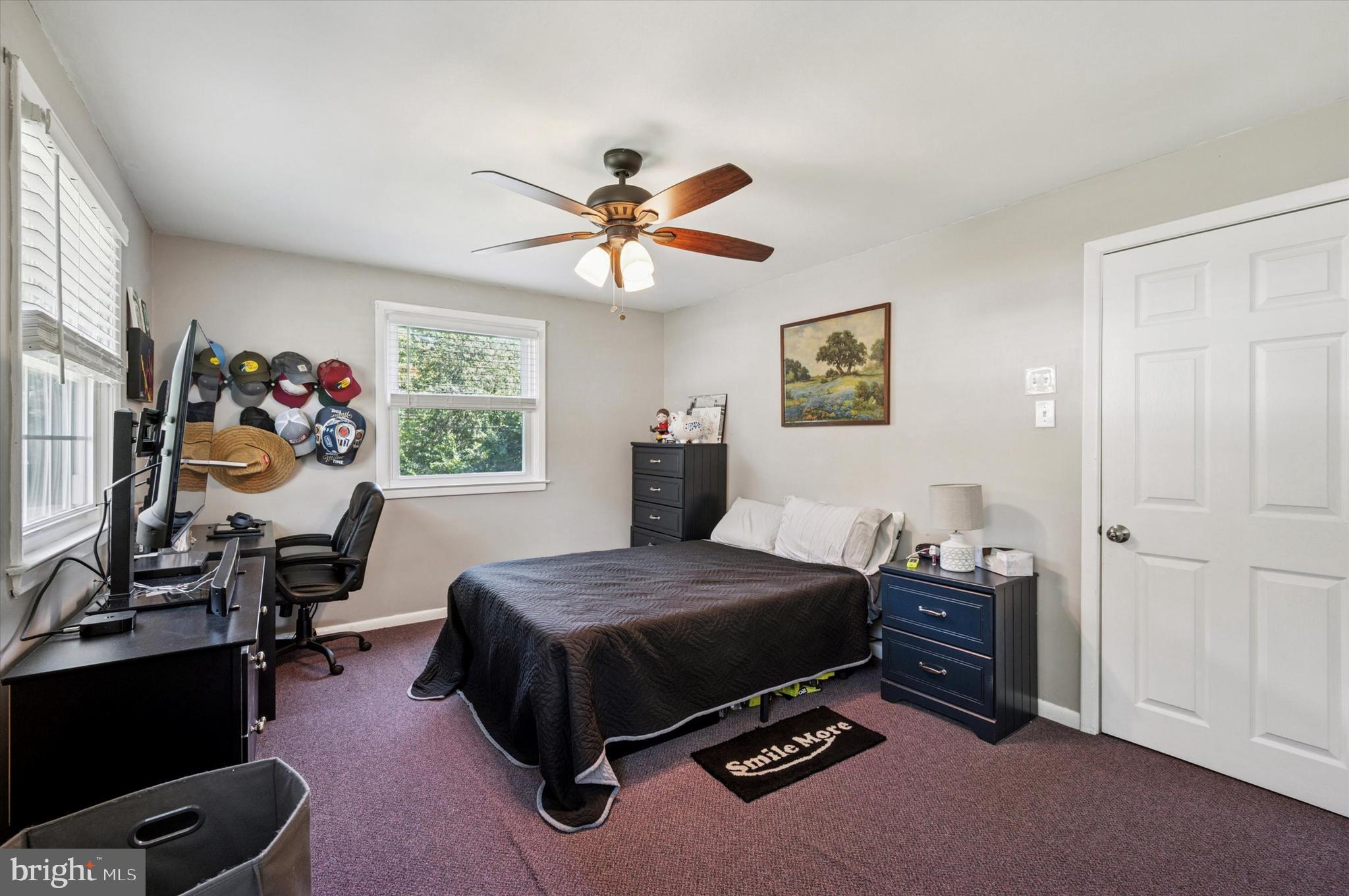 1007 Glen Road Wallingford, PA 19086 - Photo 29 of 50 a bedroom with a bed and a chandelier