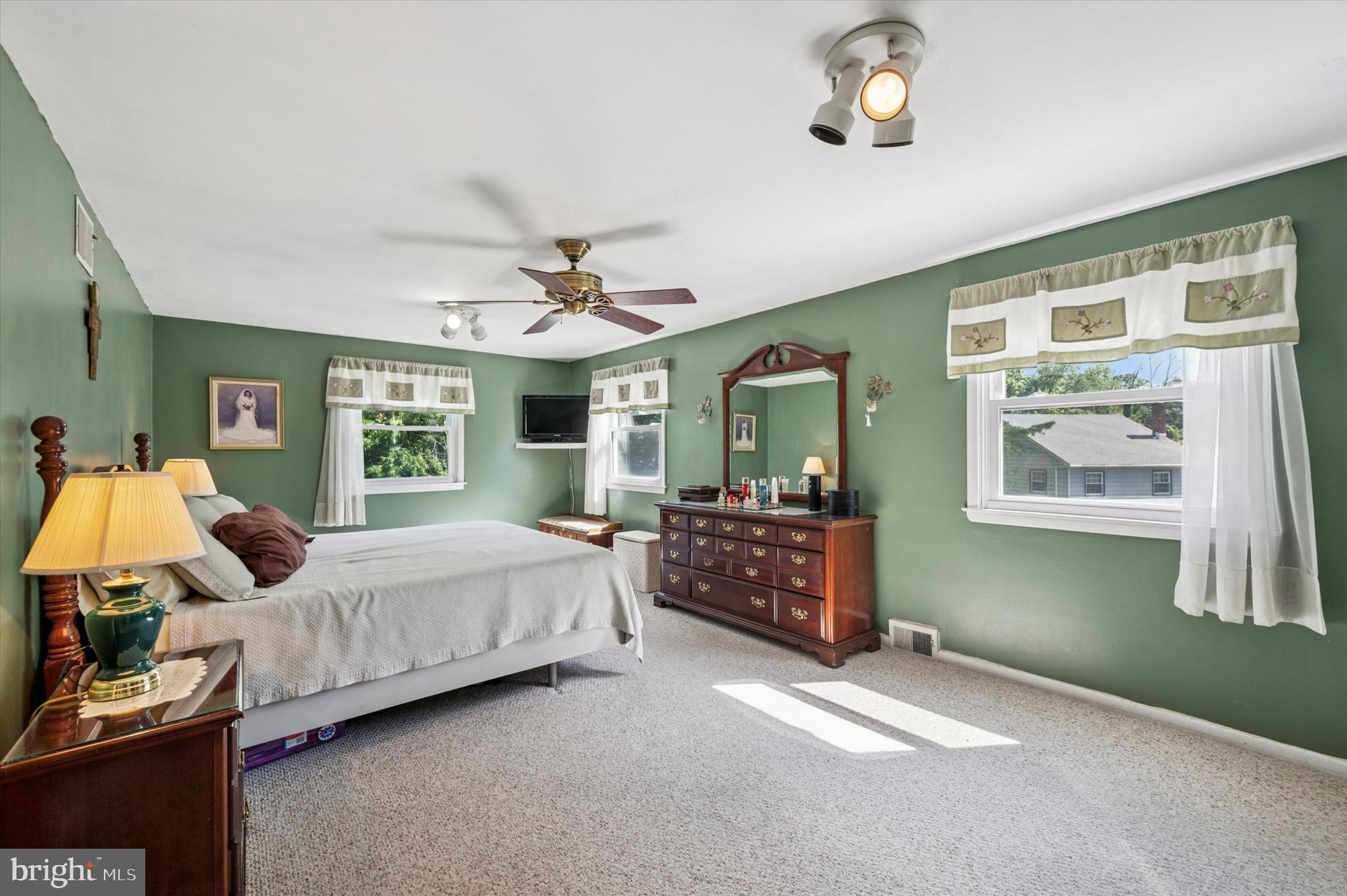 1007 Glen Road Wallingford, PA 19086 - Photo 32 of 50 a bedroom with a bed couch and window