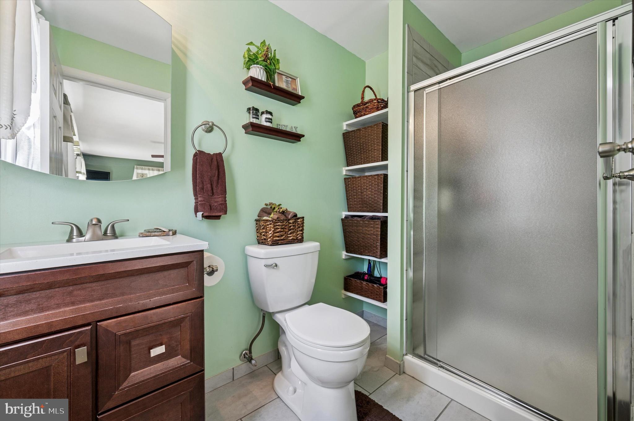 1007 Glen Road Wallingford, PA 19086 - Photo 34 of 50 a bathroom with a sink a toilet and shower