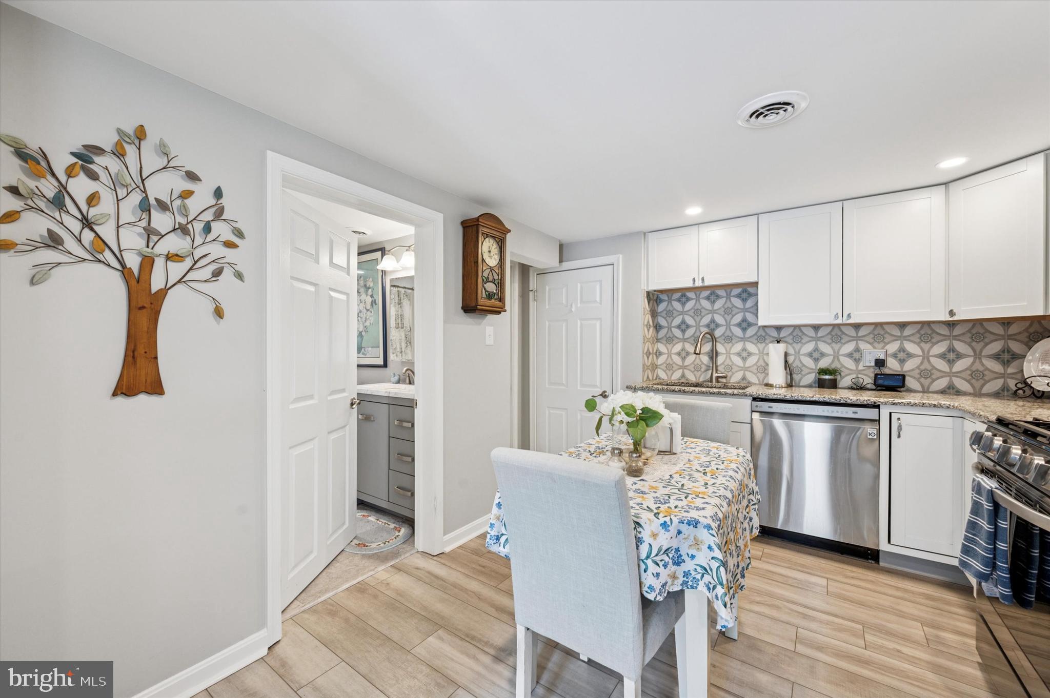 1007 Glen Road Wallingford, PA 19086 - Photo 38 of 50 a kitchen with stainless steel appliances granite countertop a refrigerator and a stove top oven