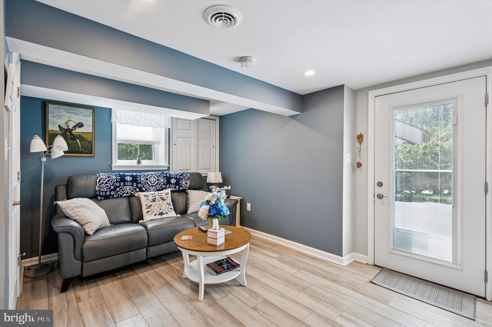 1007 Glen Road Wallingford, PA 19086 - Photo 39 of 50 a living room with furniture and a wooden floor