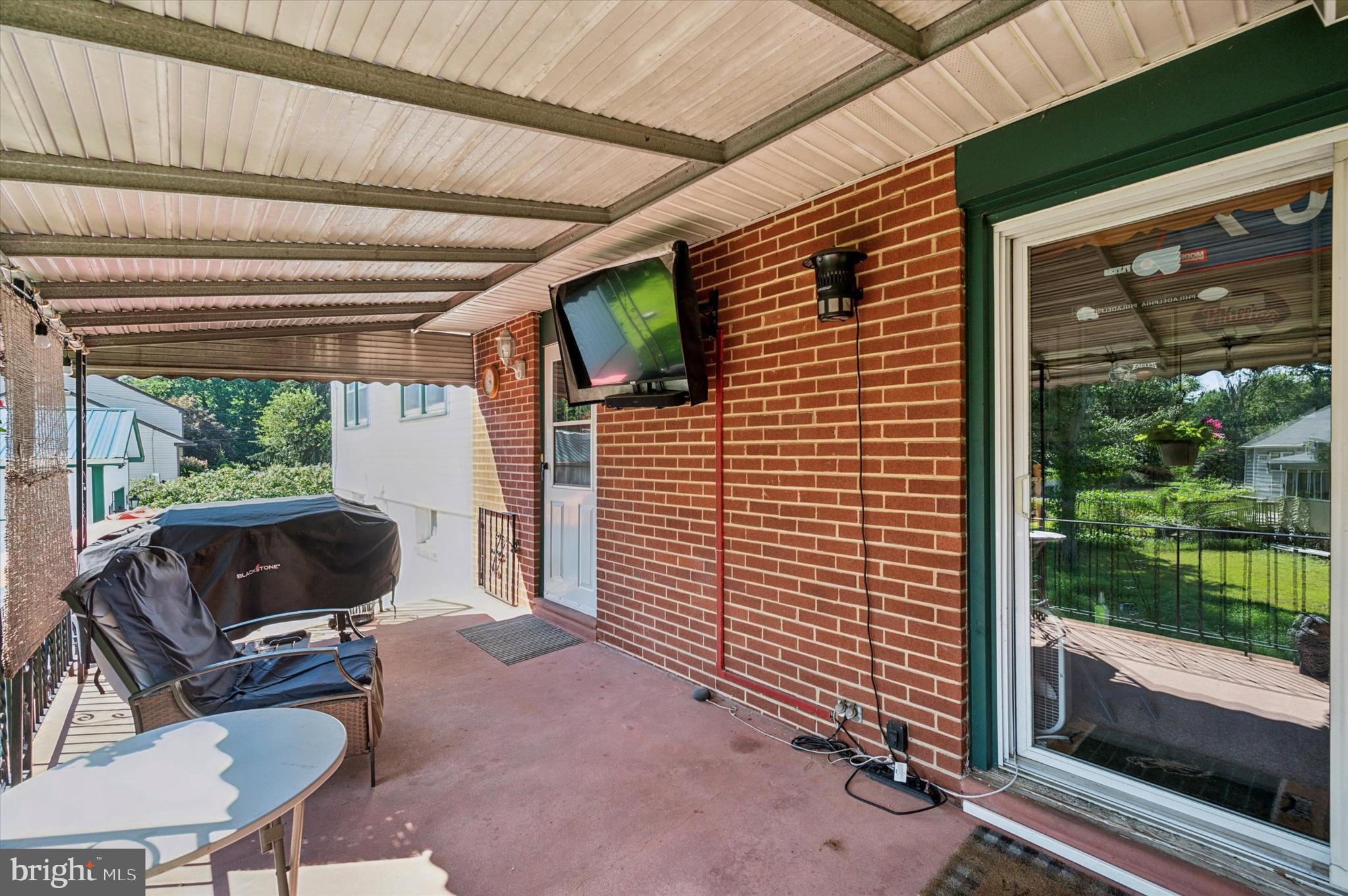 1007 Glen Road Wallingford, PA 19086 - Photo 46 of 50 a view of house with backyard outdoor seating and green space