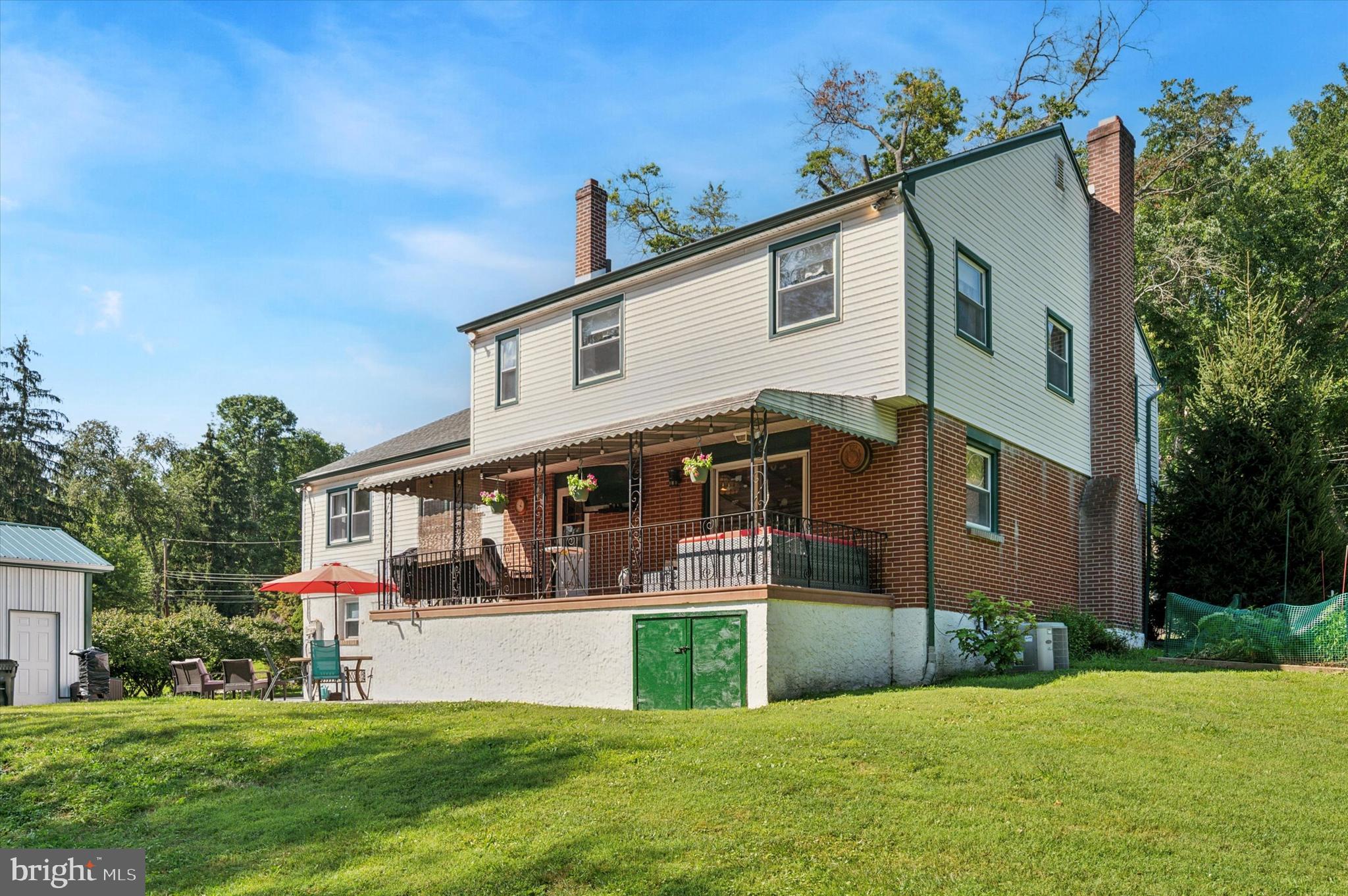 1007 Glen Road Wallingford, PA 19086 - Photo 49 of 50 a view of house with a yard and potted plants