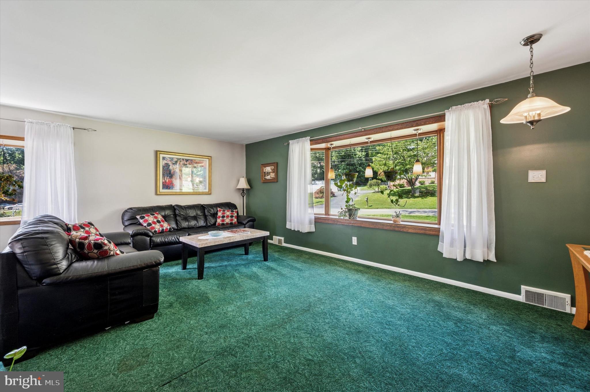 1007 Glen Road Wallingford, PA 19086 - Photo 10 of 50 a living room with furniture and a large window