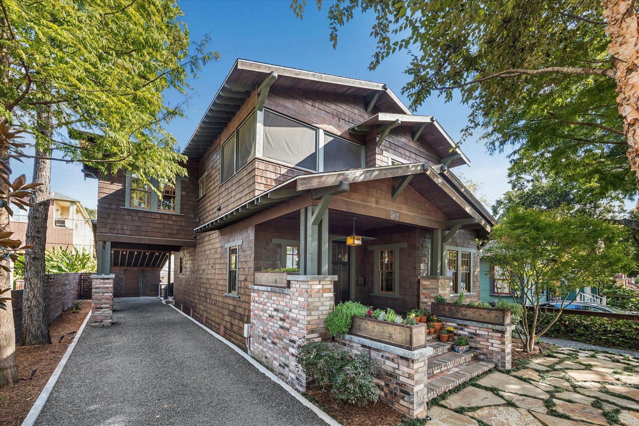 a front view of a house with garden