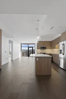 a view of kitchen with microwave and cabinets