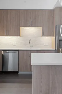 a kitchen with a sink and cabinets