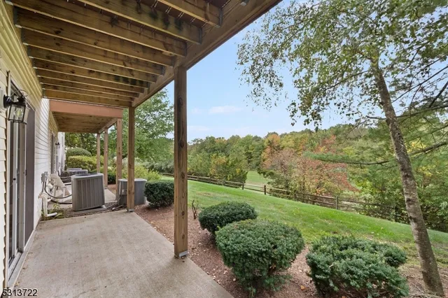 a view of a porch with furniture and garden