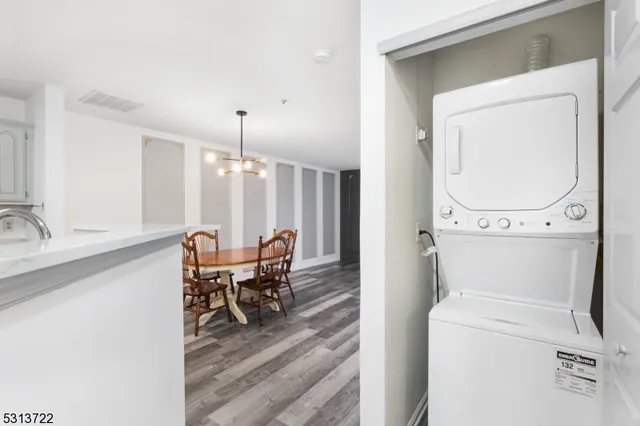 a view of a hallway with furniture and front door