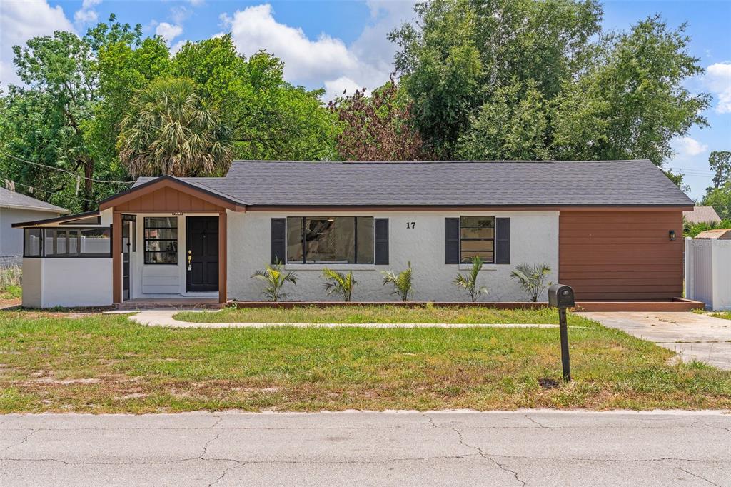 17 Palmira Road DeBary, FL 32713 - Photo 1 of 28 a white house with a large pool in front of a house