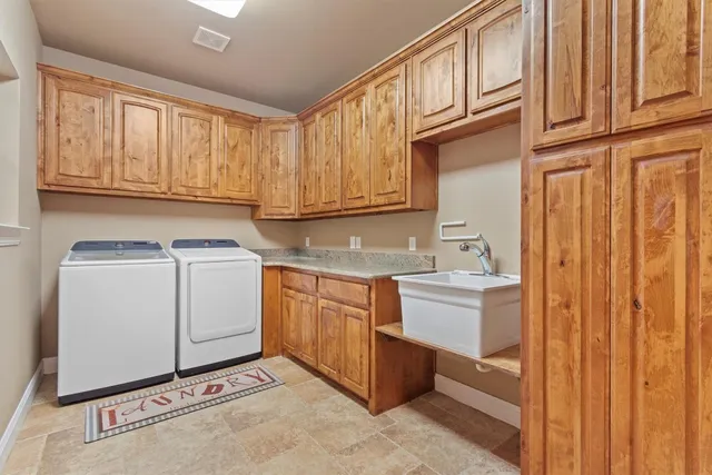 a living room with furniture a window and a chandelier