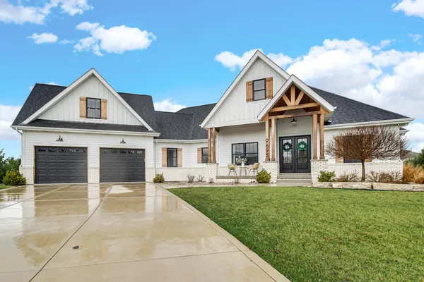 a front view of a house with a yard