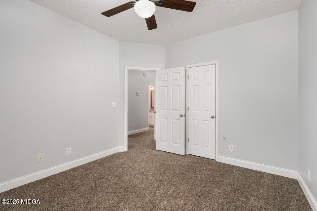 104 Browning Pointe Road Macon, GA 31216 - Photo 23 of 38 an empty room with chandelier fan