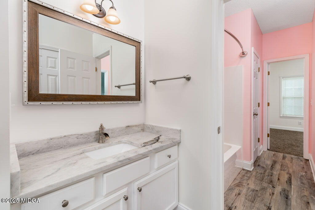 104 Browning Pointe Road Macon, GA 31216 - Photo 27 of 38 a bathroom with a sink and a mirror
