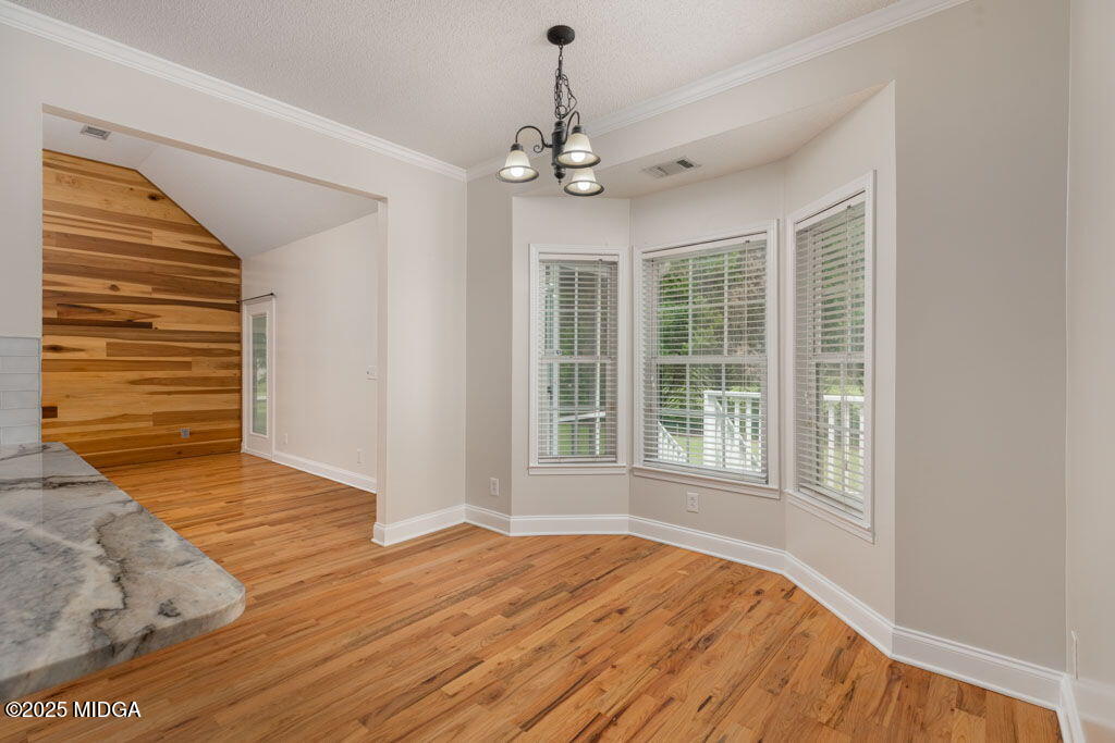 104 Browning Pointe Road Macon, GA 31216 - Photo 35 of 38 a view of an empty room with wooden floor and a window