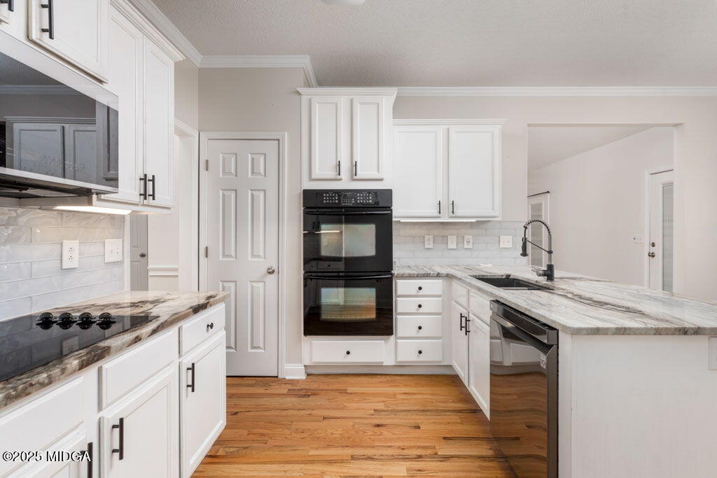104 Browning Pointe Road Macon, GA 31216 - Photo 36 of 38 a kitchen with stainless steel appliances granite countertop a stove and a sink