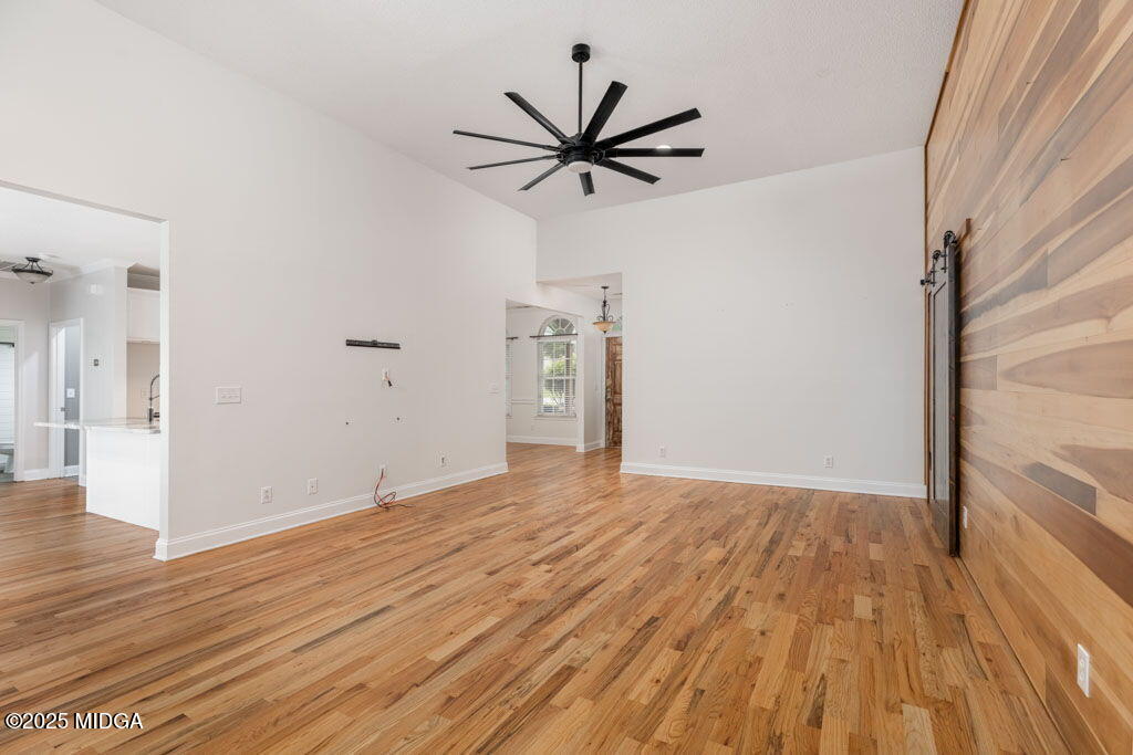 104 Browning Pointe Road Macon, GA 31216 - Photo 4 of 38 a view of a livingroom with wooden floor and a ceiling fan