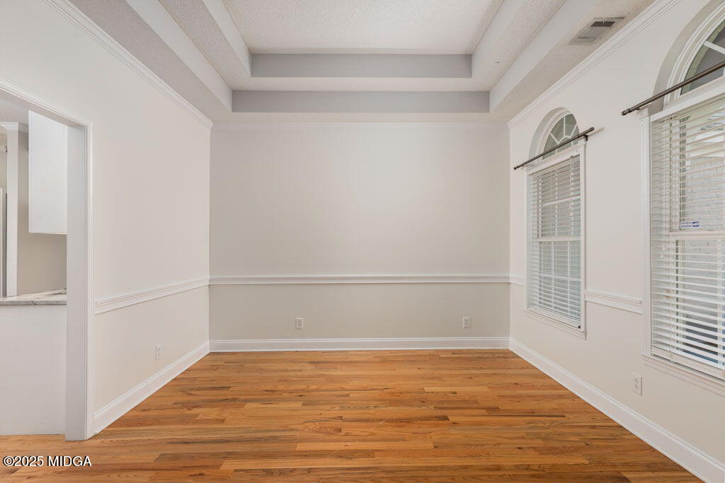 104 Browning Pointe Road Macon, GA 31216 - Photo 6 of 38 a view of an empty room with wooden floor and a window