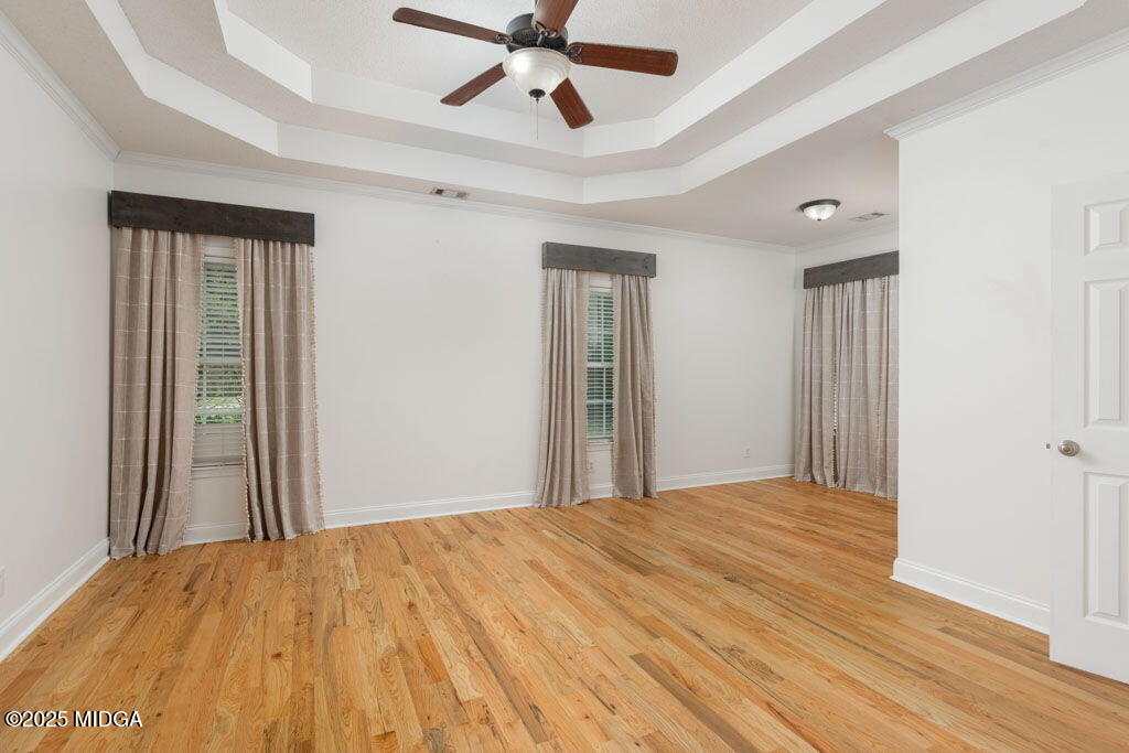 104 Browning Pointe Road Macon, GA 31216 - Photo 10 of 38 a view of a room with wooden floor and ceiling fan