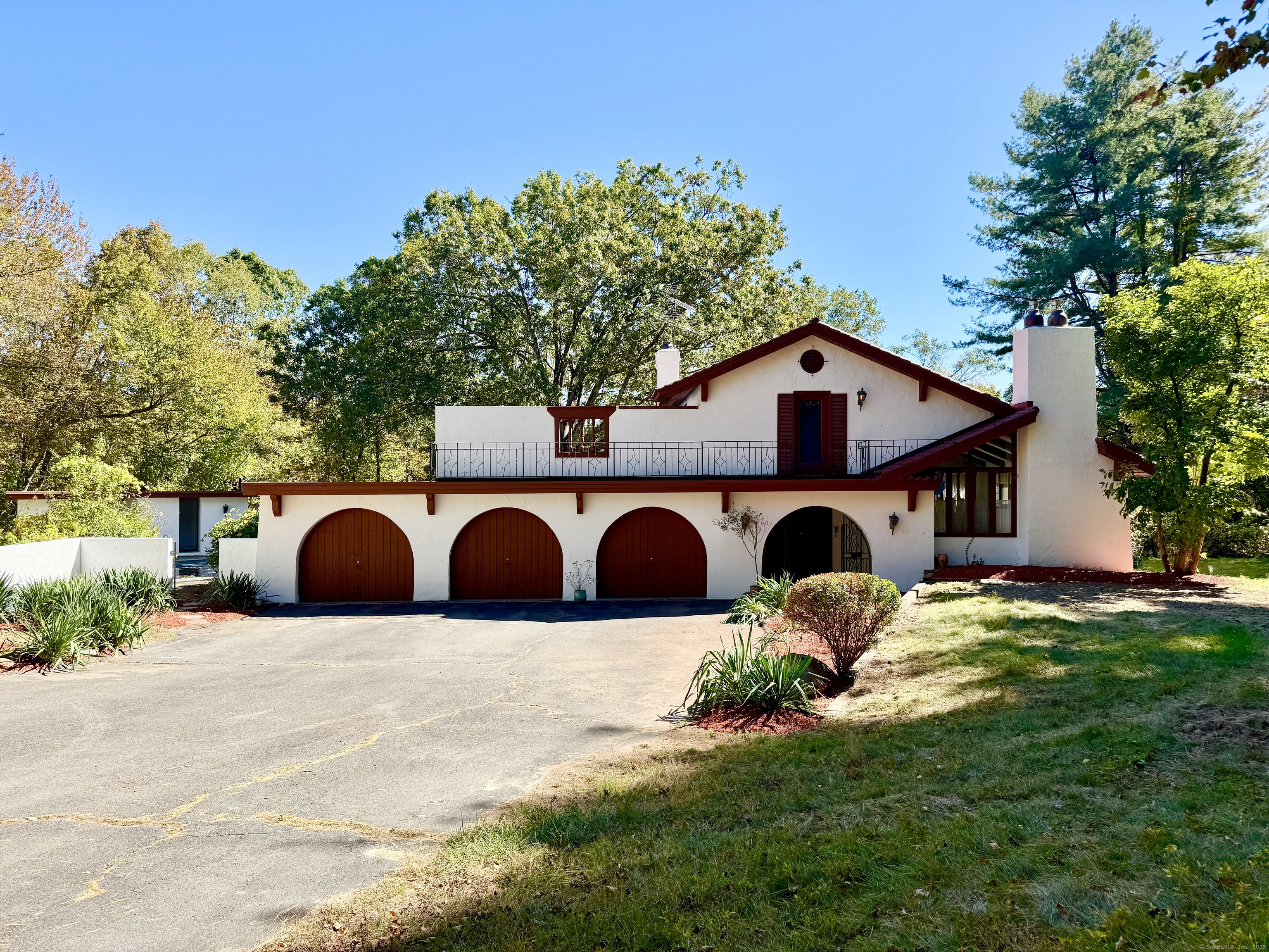 a view of a house with large trees