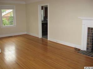 3711 Park Road Charlotte, NC 28209 - Photo 5 of 16 an empty room with wooden floor and windows