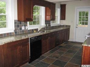 3711 Park Road Charlotte, NC 28209 - Photo 6 of 16 a kitchen with a sink a window and cabinets