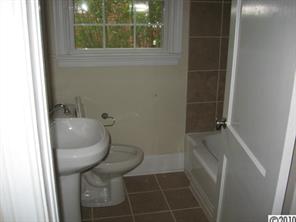 3711 Park Road Charlotte, NC 28209 - Photo 10 of 16 a bathroom with a sink and toilet