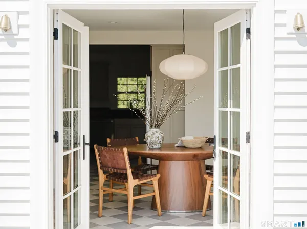 a dining room with furniture and window
