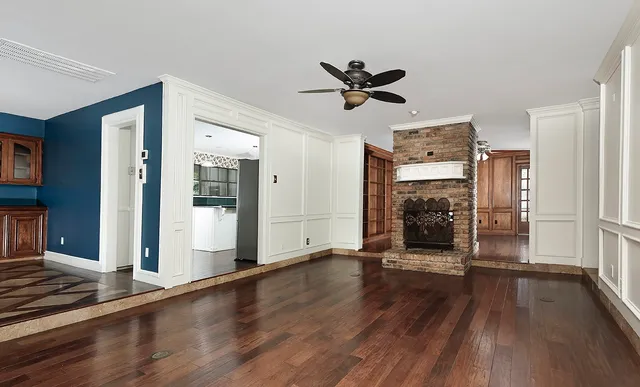 a view of a livingroom with wooden floor