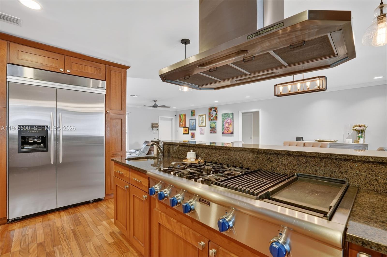 4710 Grant Street Hollywood, FL 33021 - Photo 12 of 56 a stove top oven sitting inside of a kitchen