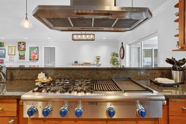 a kitchen with a refrigerator and cabinets