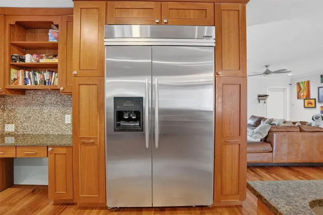 a stove top oven sitting inside of a kitchen