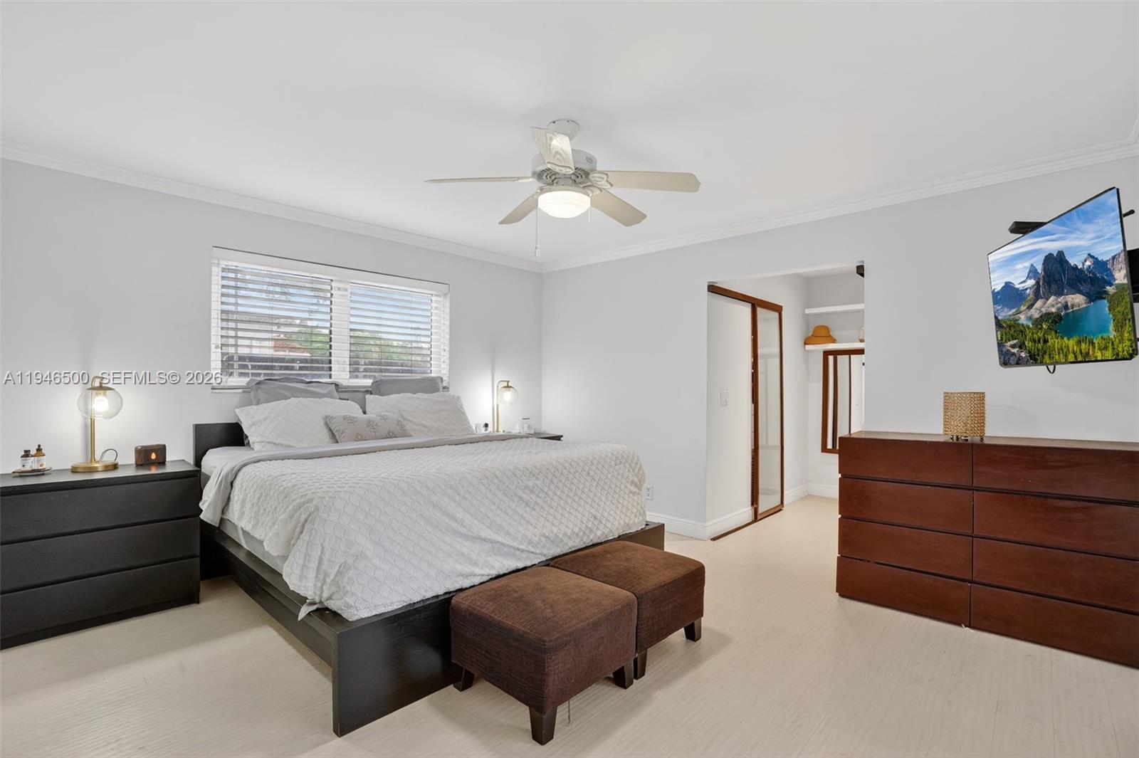 4710 Grant Street Hollywood, FL 33021 - Photo 18 of 56 a bedroom with a bed and a flat screen tv