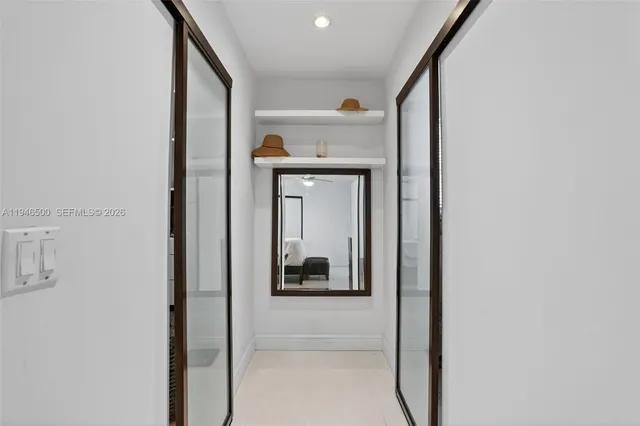 a bathroom with a shower a toilet and a sink