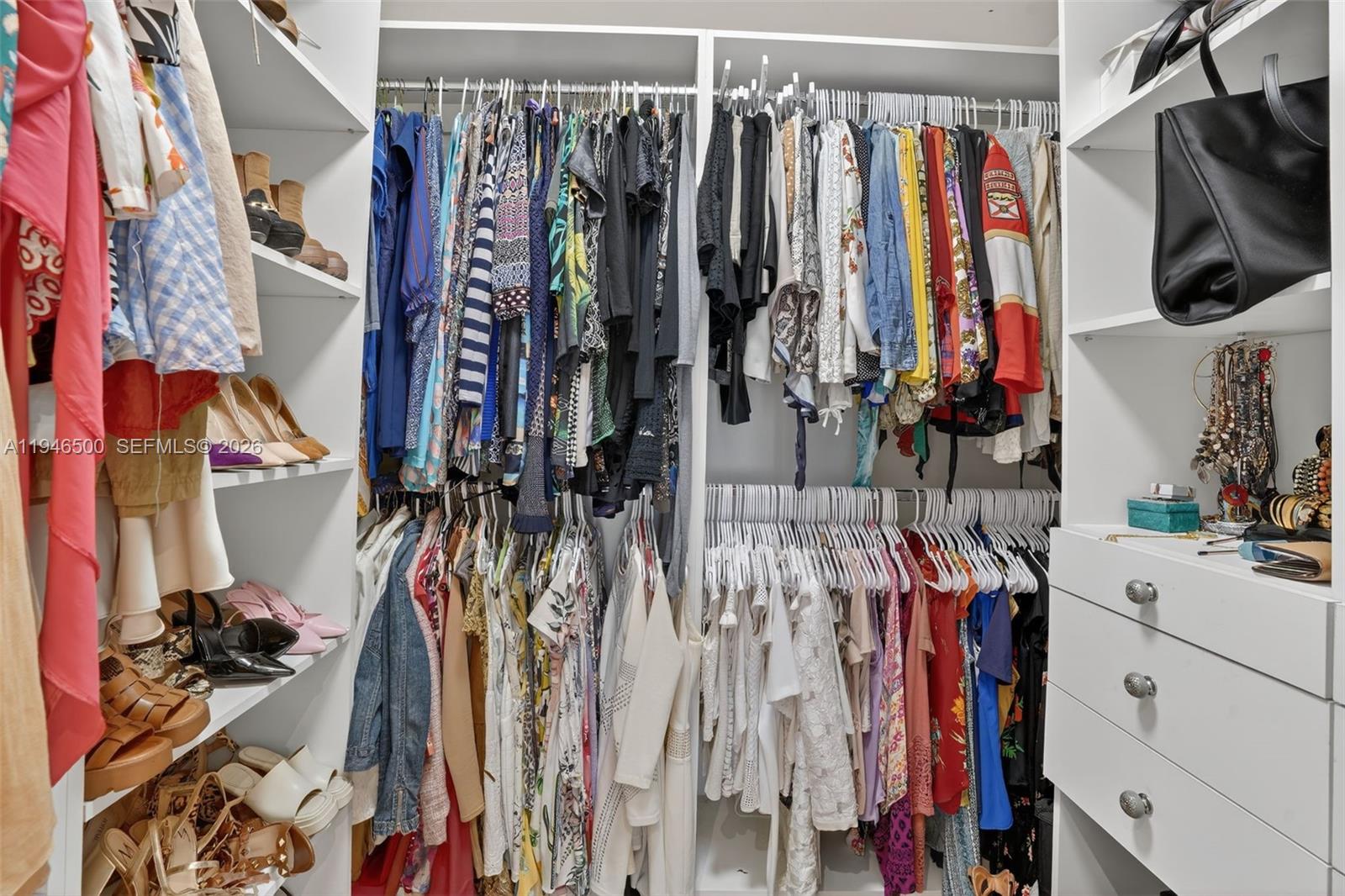 4710 Grant Street Hollywood, FL 33021 - Photo 21 of 56 a view of walk in closet with clothes