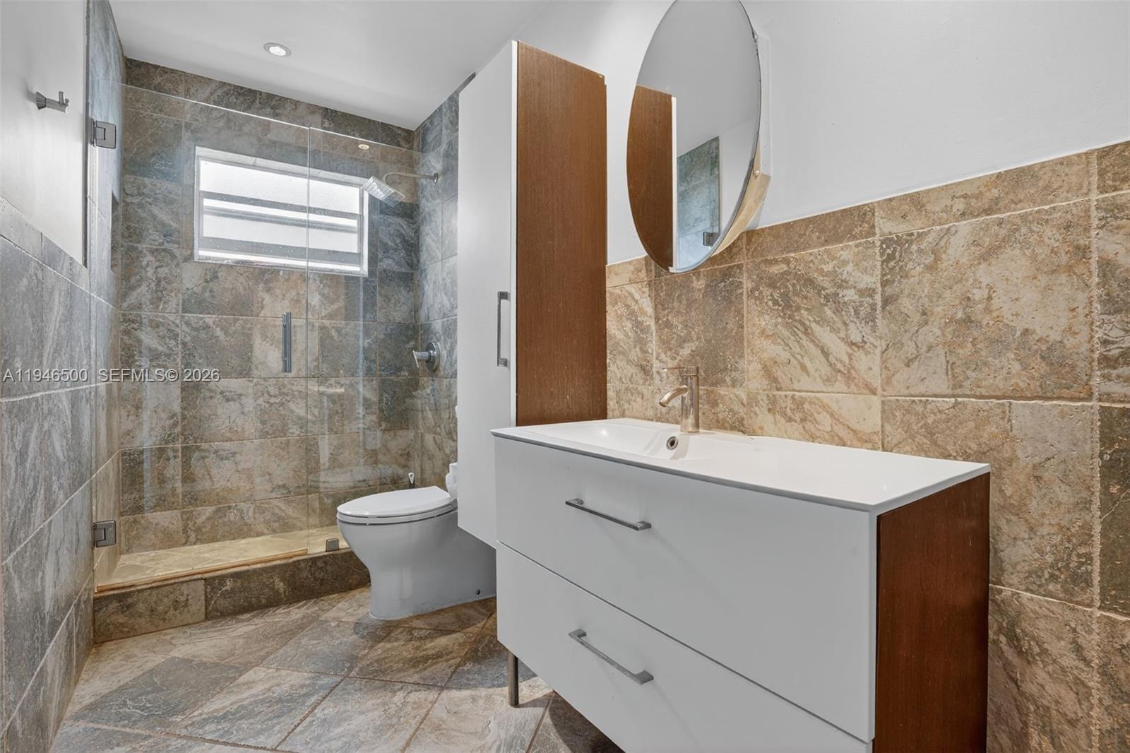 4710 Grant Street Hollywood, FL 33021 - Photo 26 of 56 a bathroom with a sink toilet and shower