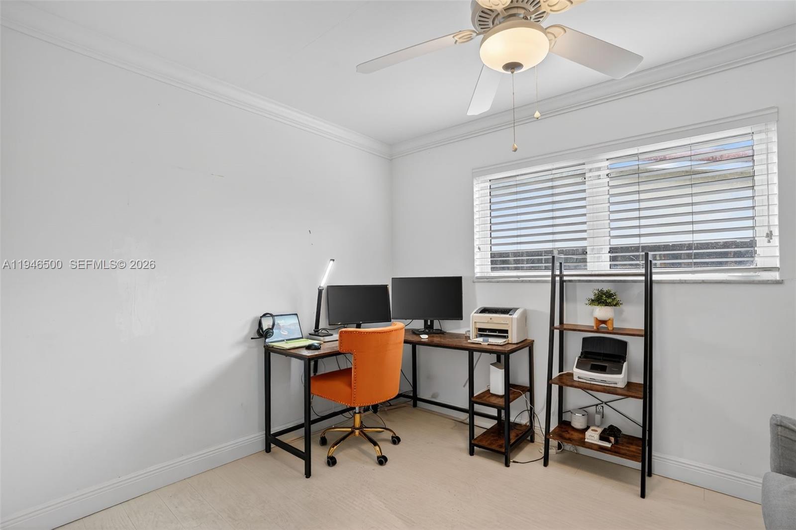 4710 Grant Street Hollywood, FL 33021 - Photo 28 of 56 a view of a workspace with furniture and a window