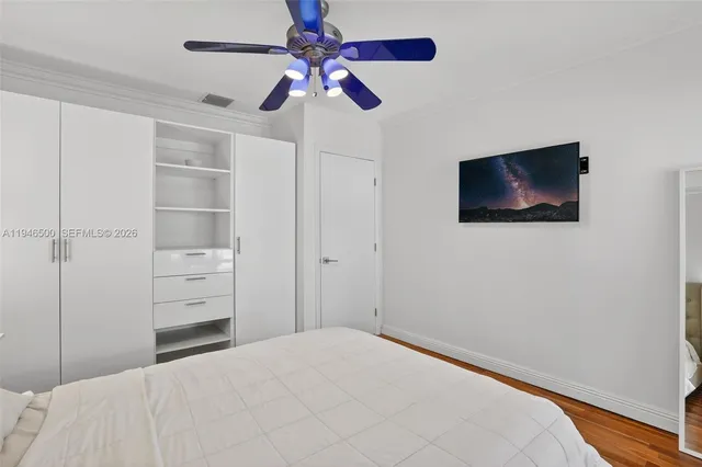 a living room with furniture and a lamp