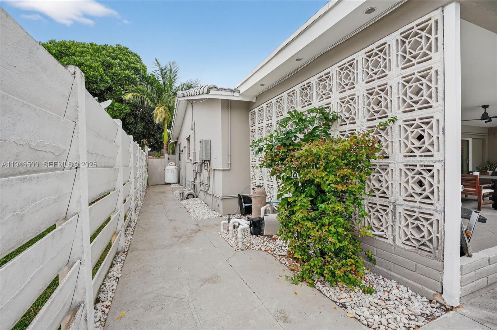 4710 Grant Street Hollywood, FL 33021 - Photo 40 of 56 a view of a pathway of house with potted plants