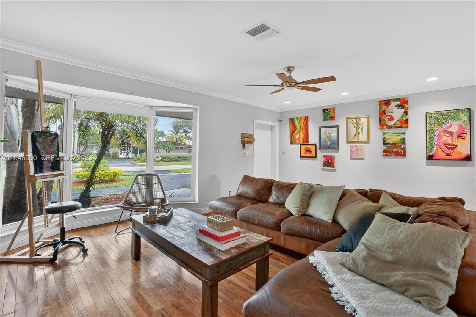 4710 Grant Street Hollywood, FL 33021 - Photo 7 of 56 a living room with furniture and a floor to ceiling window