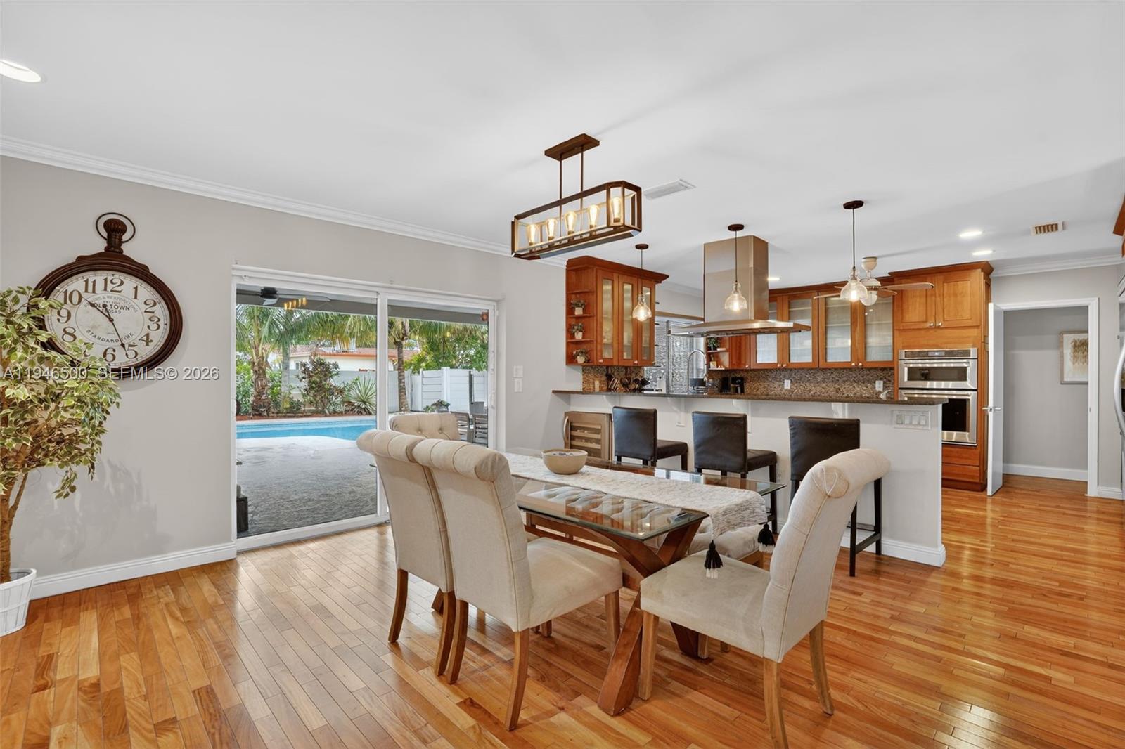 4710 Grant Street Hollywood, FL 33021 - Photo 8 of 56 a view of a dining room with furniture window and wooden floor