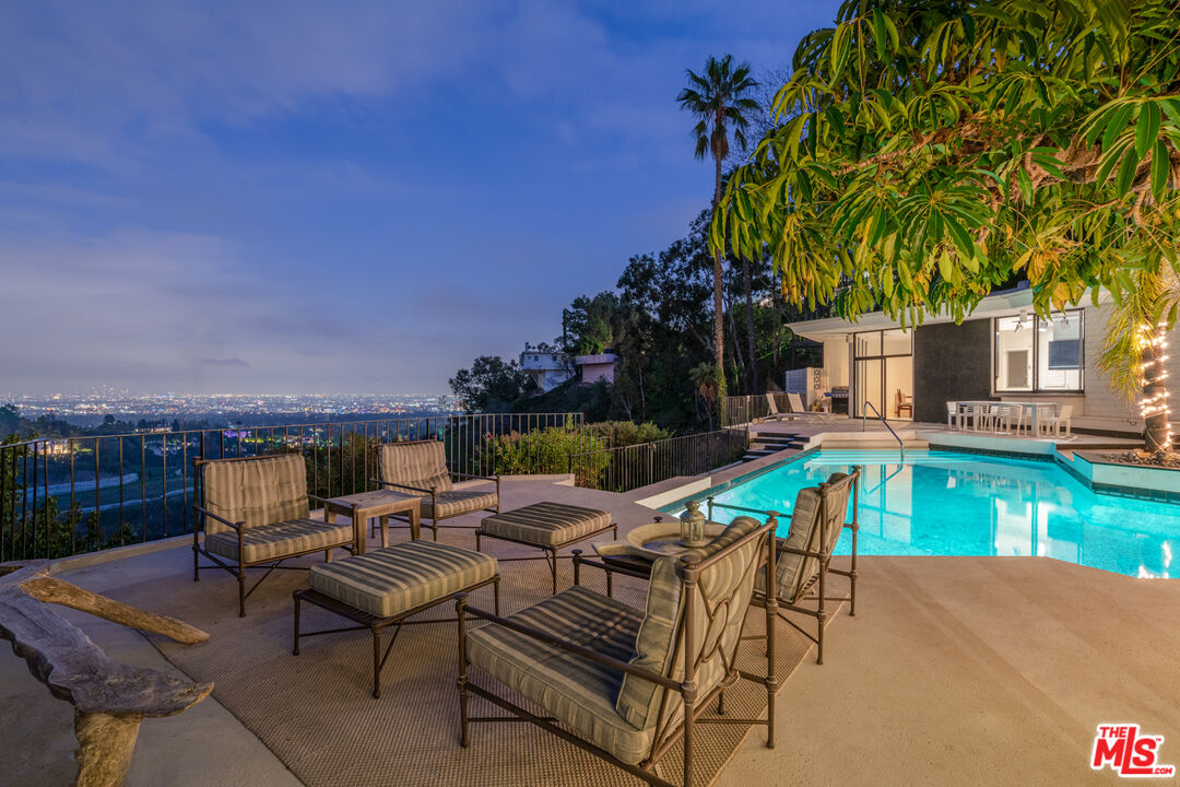 960 Stradella Road Los Angeles, CA 90077 - Photo 13 of 17 a view of a patio with chairs and a table