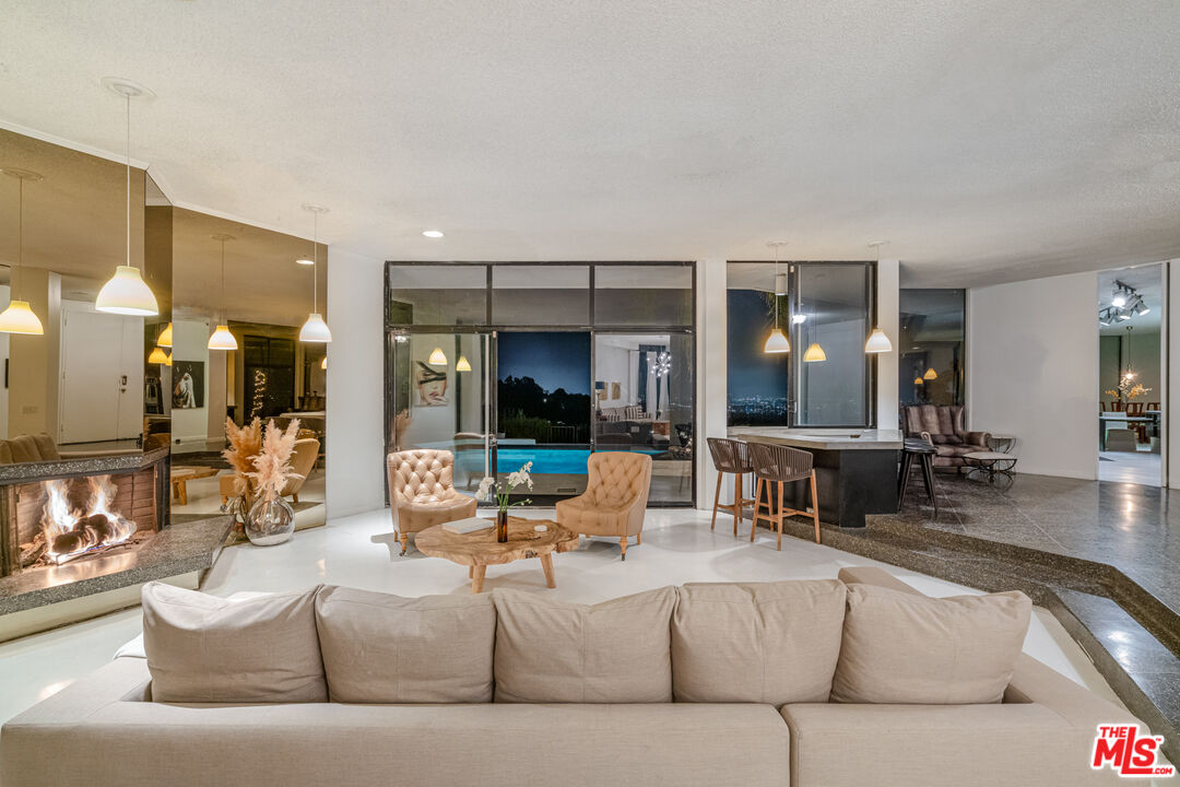 960 Stradella Road Los Angeles, CA 90077 - Photo 17 of 17 a living room with furniture and dining table