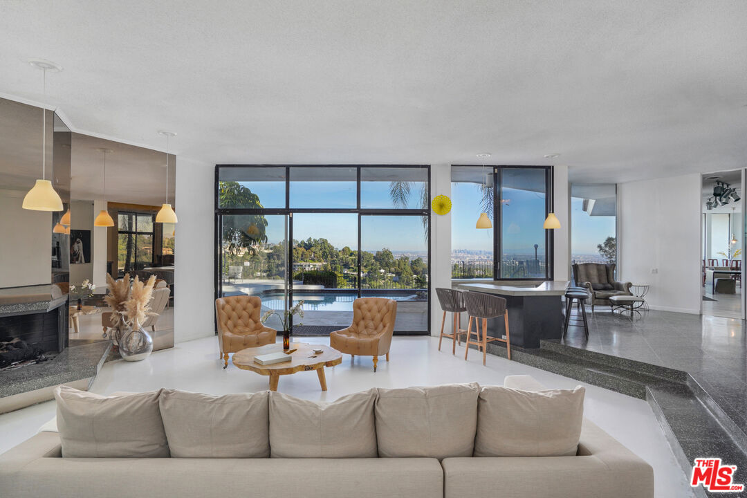 960 Stradella Road Los Angeles, CA 90077 - Photo 3 of 17 a living room with furniture and a large window