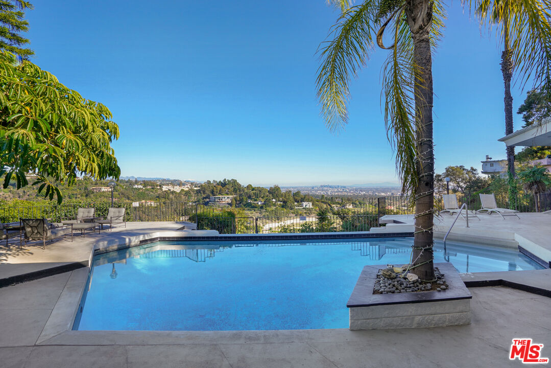 960 Stradella Road Los Angeles, CA 90077 - Photo 5 of 17 a view of a lake with a terrace